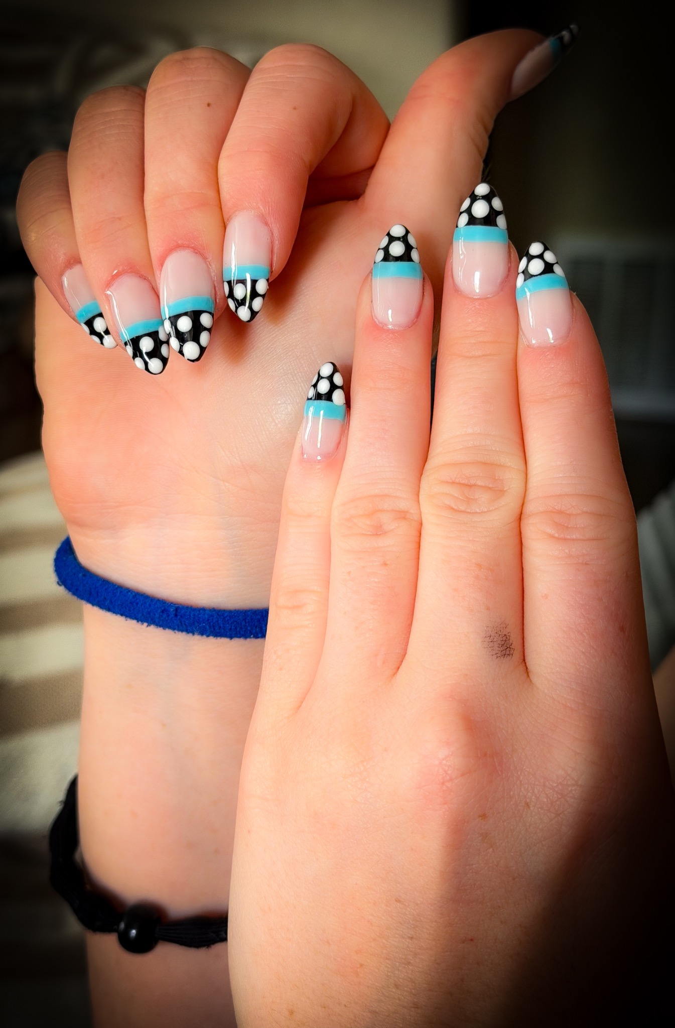 Black and white polka-dot tips with turquoise accents