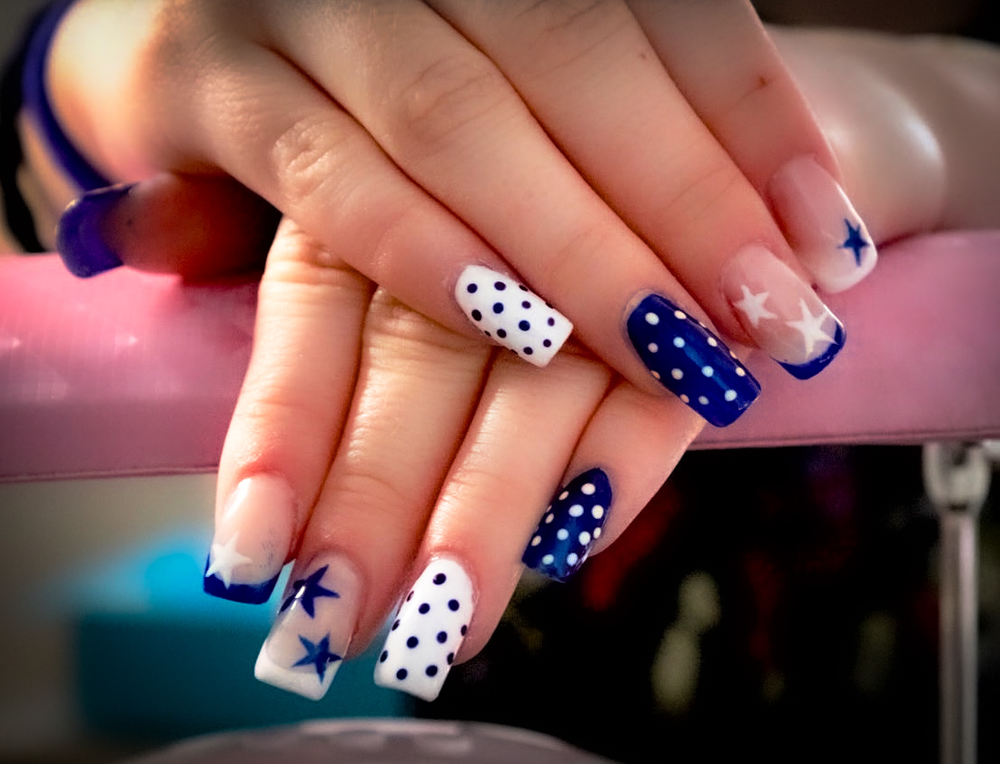 Blue and white square nails with stars and polka dots