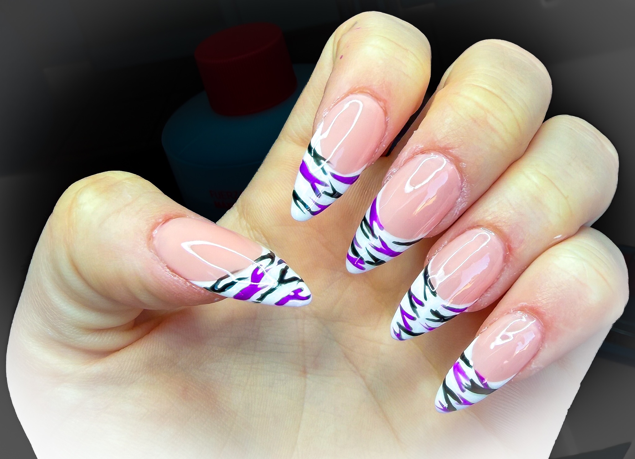 White almond tips with purple and dark abstract stripes